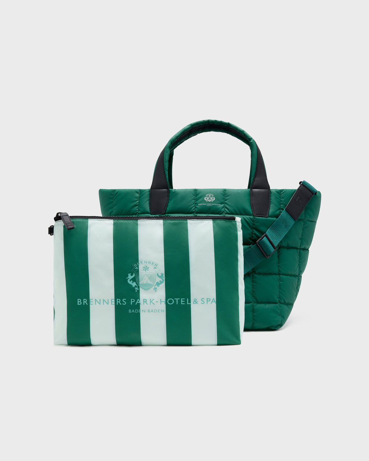 A green and white striped zippered pouch with the text 'BRENNERS PARK-HOTEL & SPA' printed on the front, displayed next to a matching green quilted tote bag with black handles and a black shoulder strap, on a light gray background.