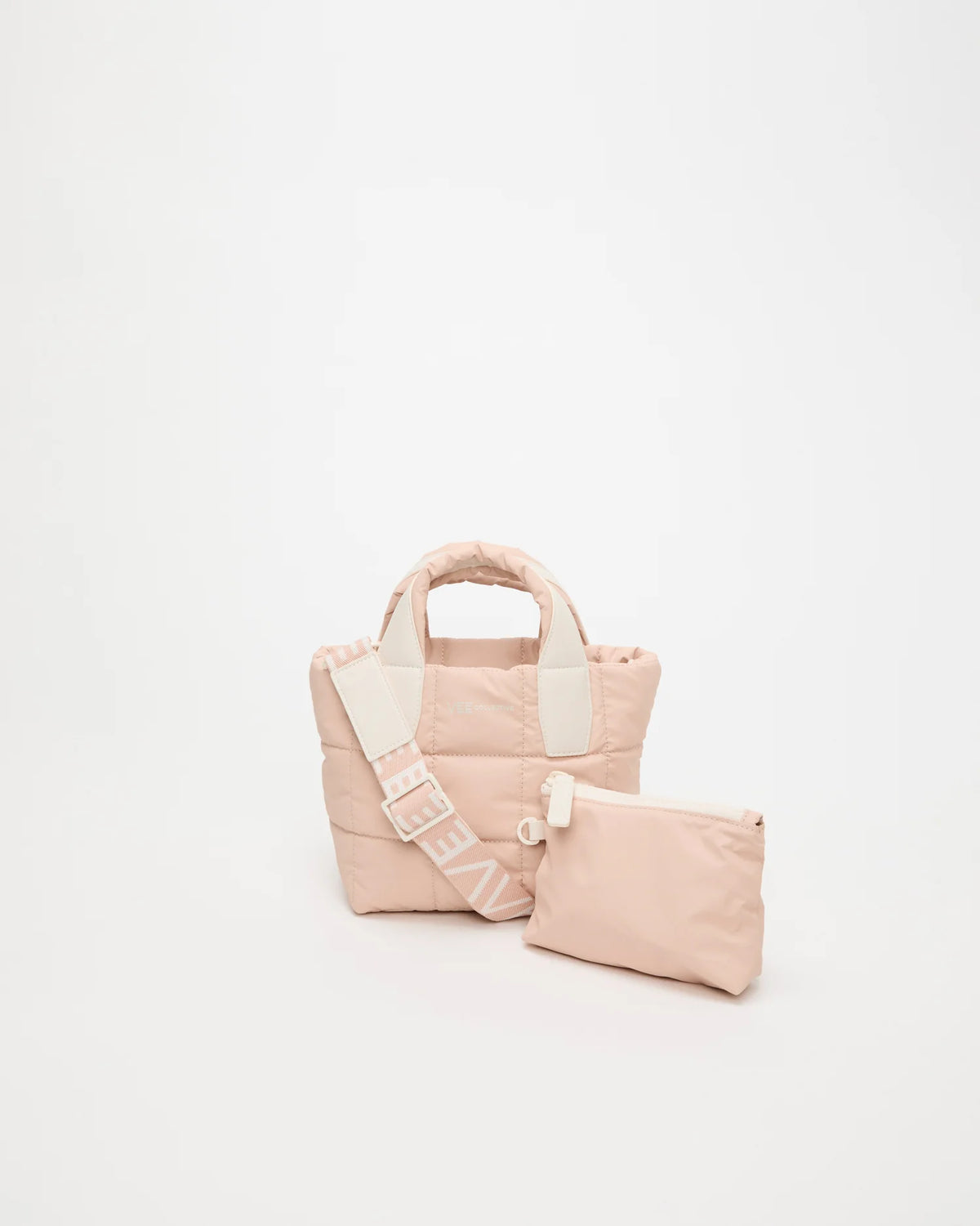Front view of the Porter Tote Bag Mini in Cameo Rose, shown with its matching pouch and detachable strap.