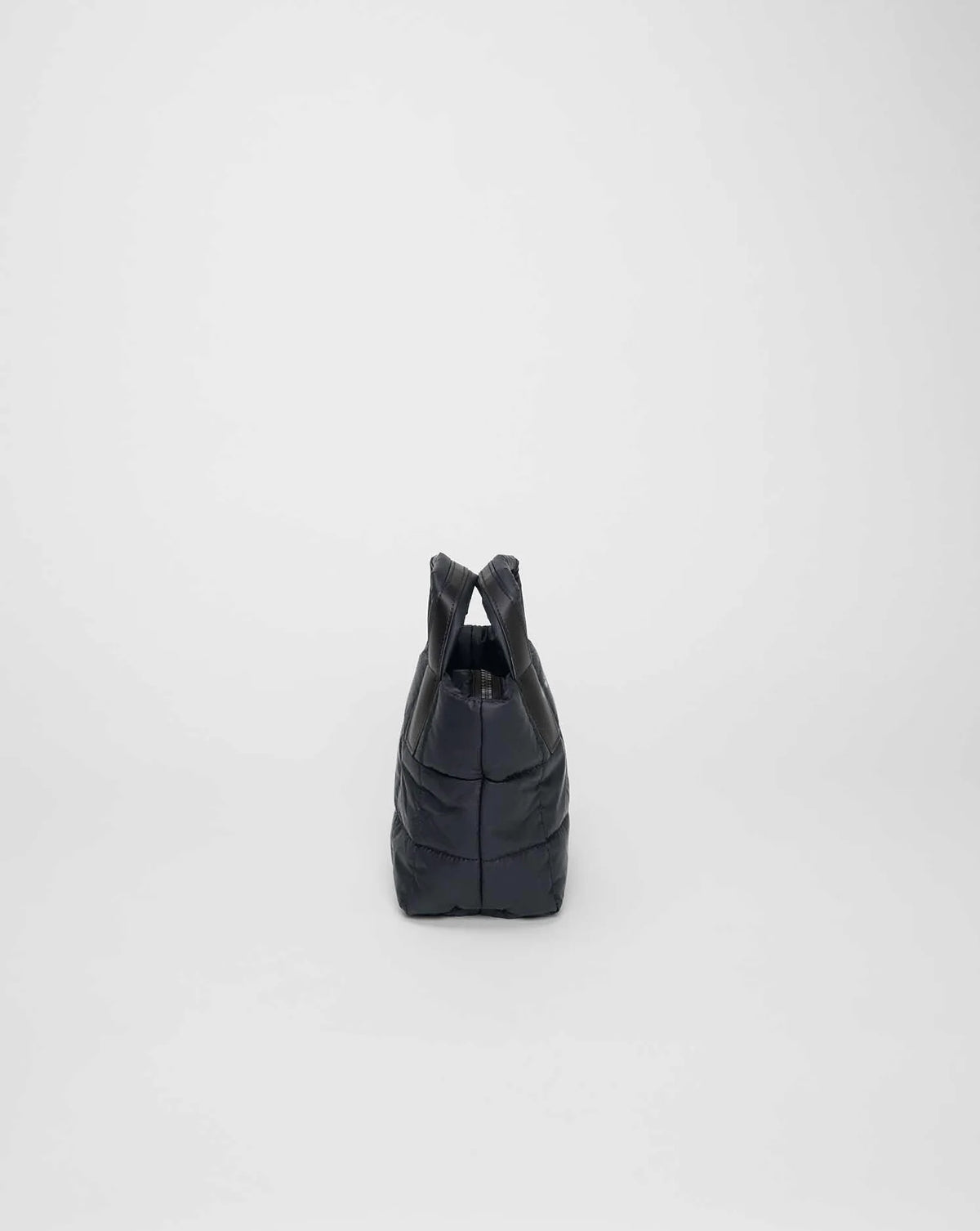 Side view product image of the Porter Mini tote bag in Dark Navy by Vee Collective.