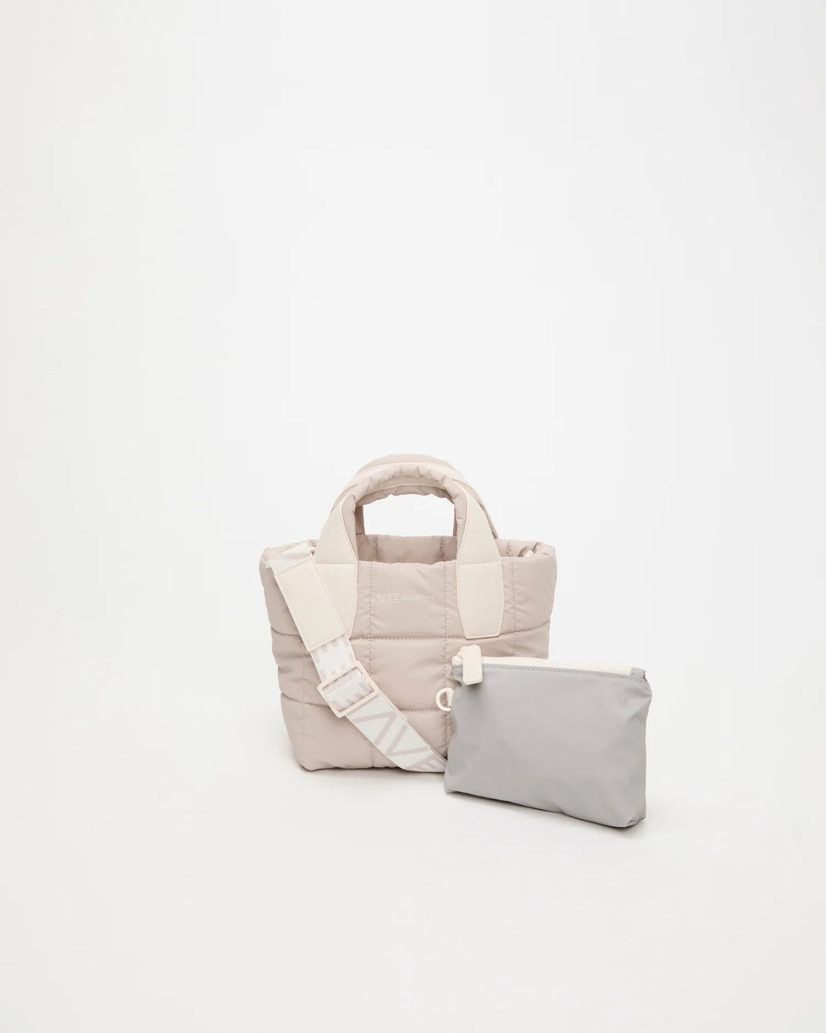 Front view of the Porter Tote Bag Mini in Soft Taupe, shown with its matching pouch and detachable strap.
