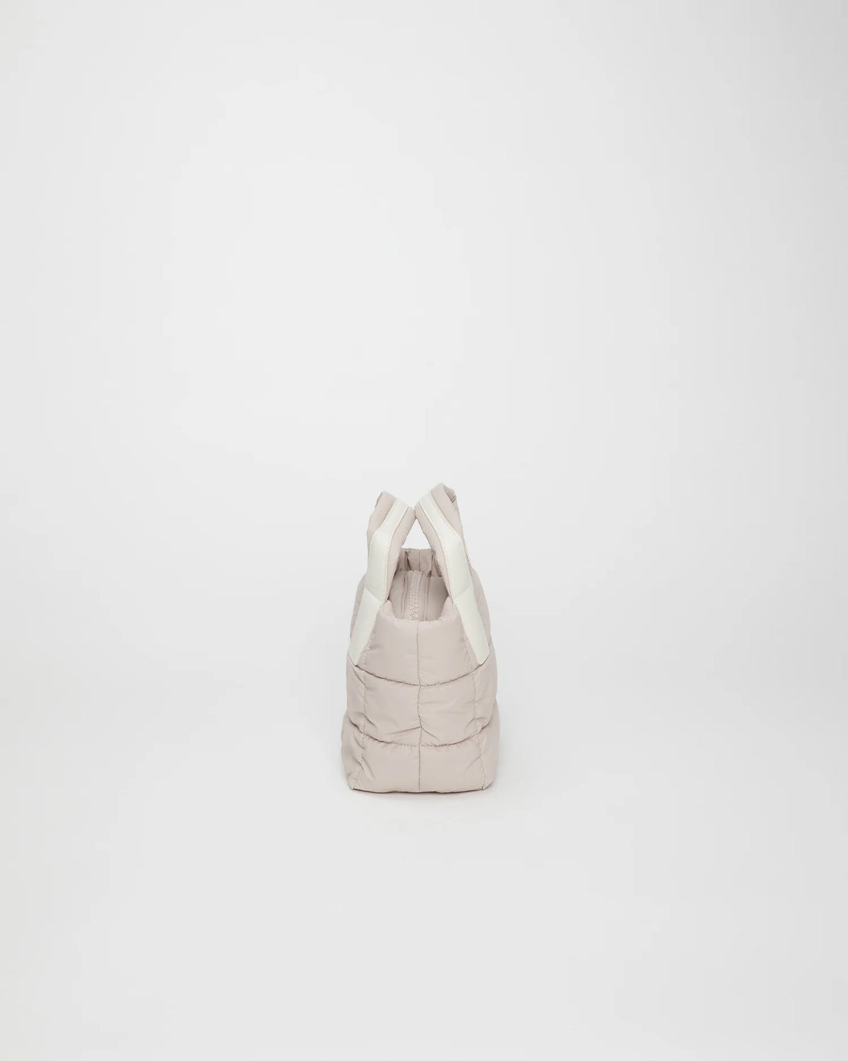 Side view product image of the Porter Mini tote bag in Soft Taupe by Vee Collective.