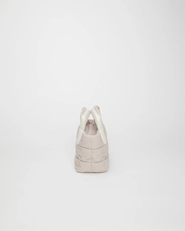 Side view product image of the Porter Mini tote bag in Soft Taupe by Vee Collective.