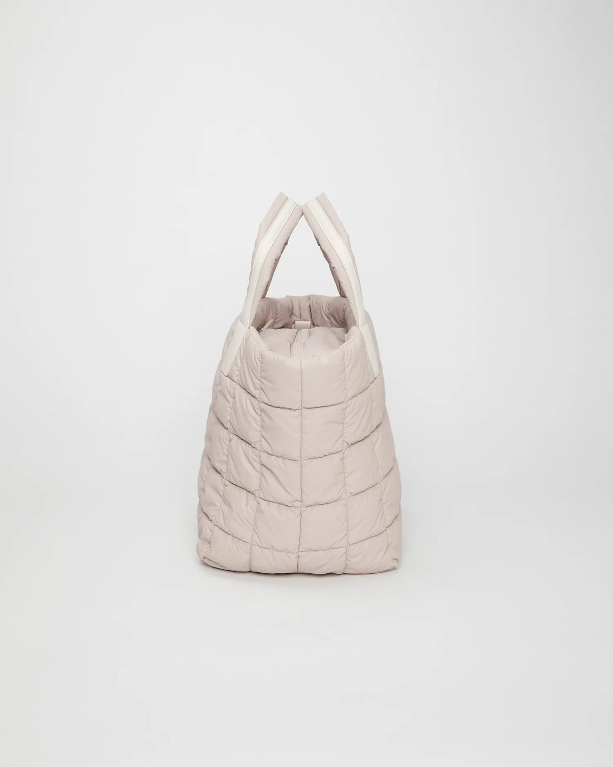 Side view product image of the Porter Tote Medium Bag in Soft Taupe by Vee Collective.