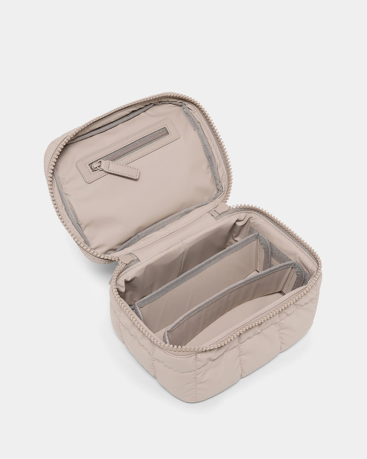 The Organizer Duo in Neutral open interior showing compartments and zip pocket