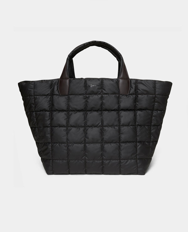 The Porter Weekender bag espresso quilted puffer tote bag with dark brown leather handles, shown against a white background.
