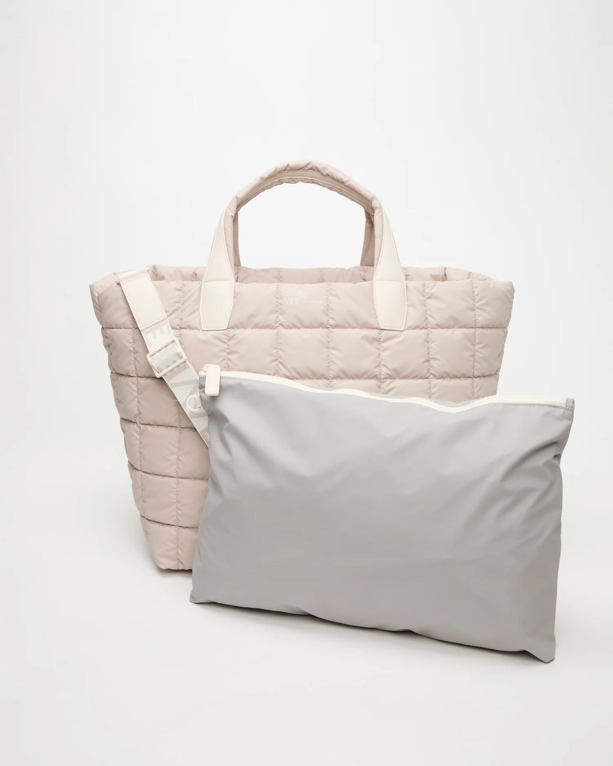 Front view of the Porter Weekender Tote Bag in Soft Taupe, shown with its matching pouch and detachable strap.