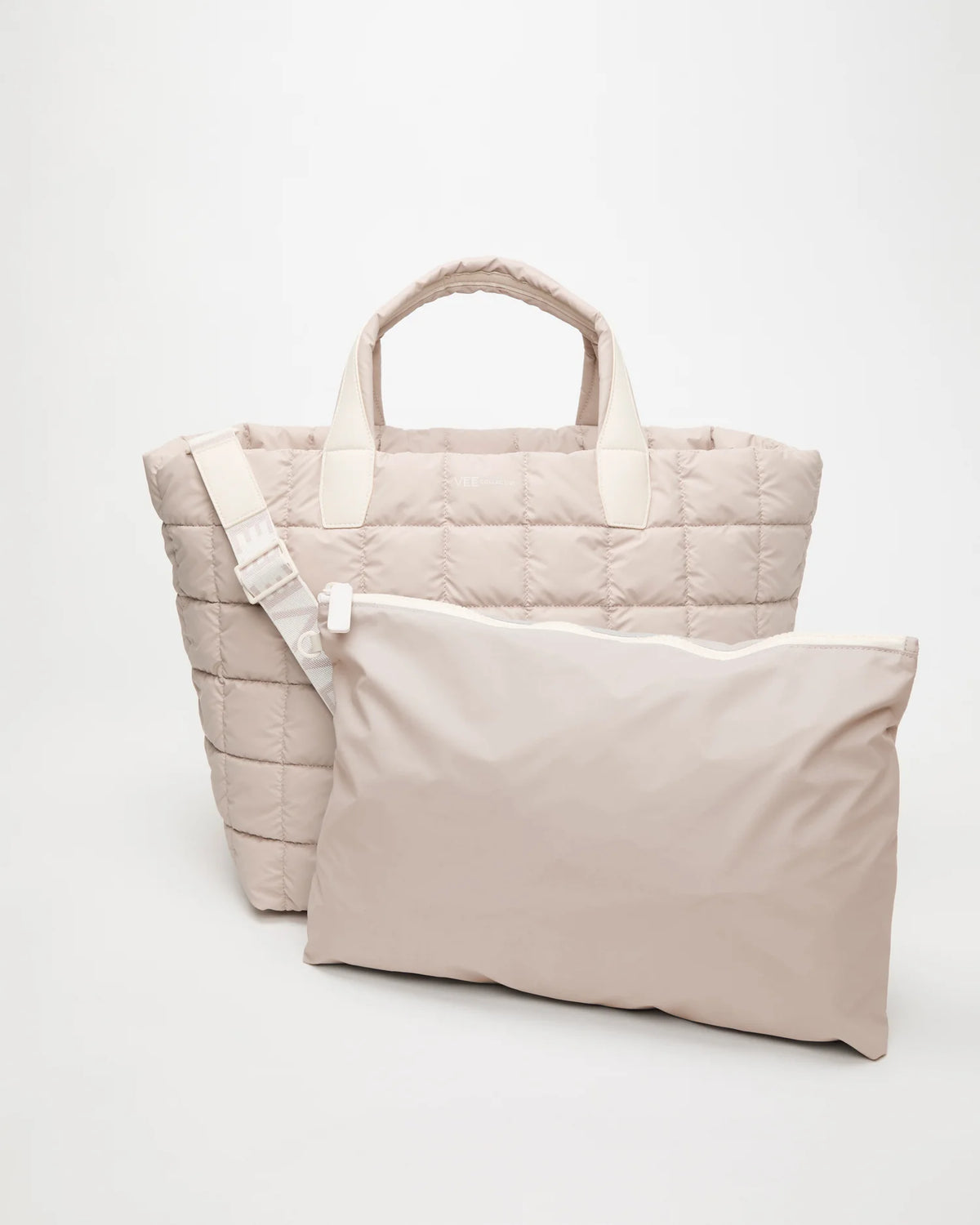 Front view of the Vee Collective Porter Weekender in Soft Taupe with matching pouch and detachable strap.