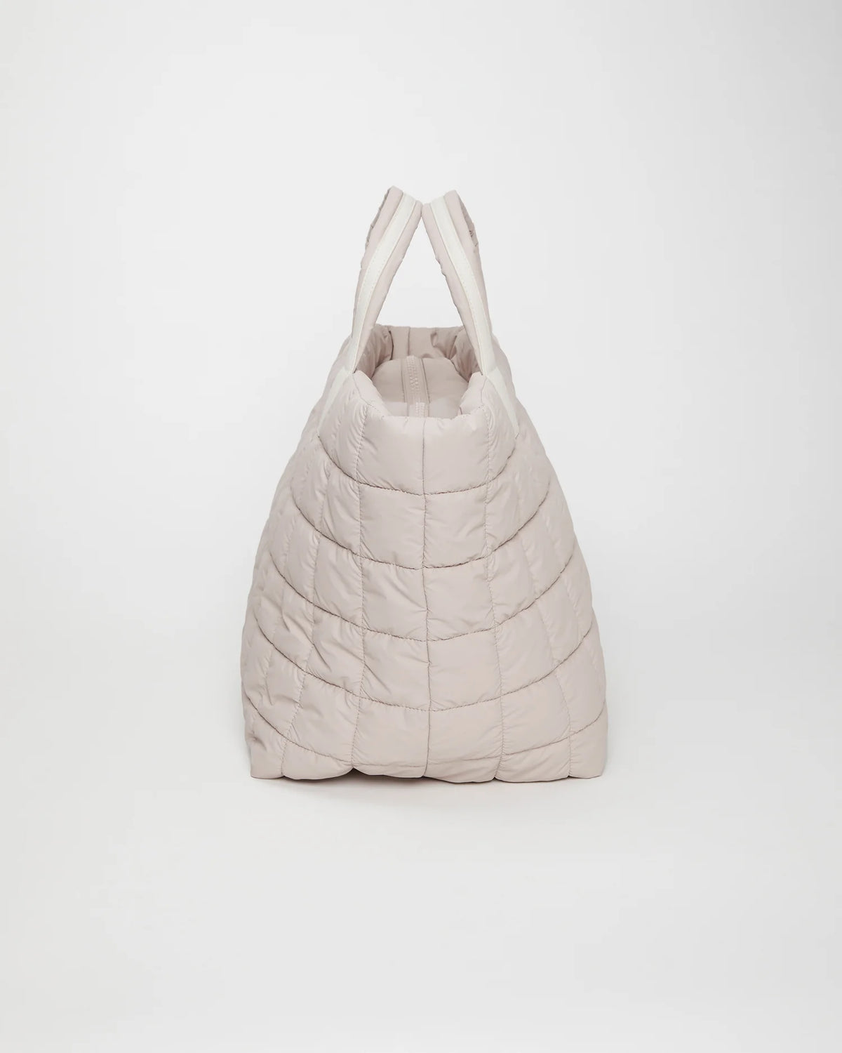 Side view product image of the Porter Weekender tote bag in Soft Taupe by Vee Collective.