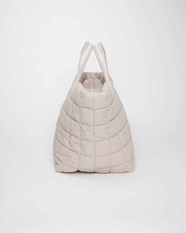 Side view product image of the Porter Weekender tote bag in Soft Taupe by Vee Collective.
