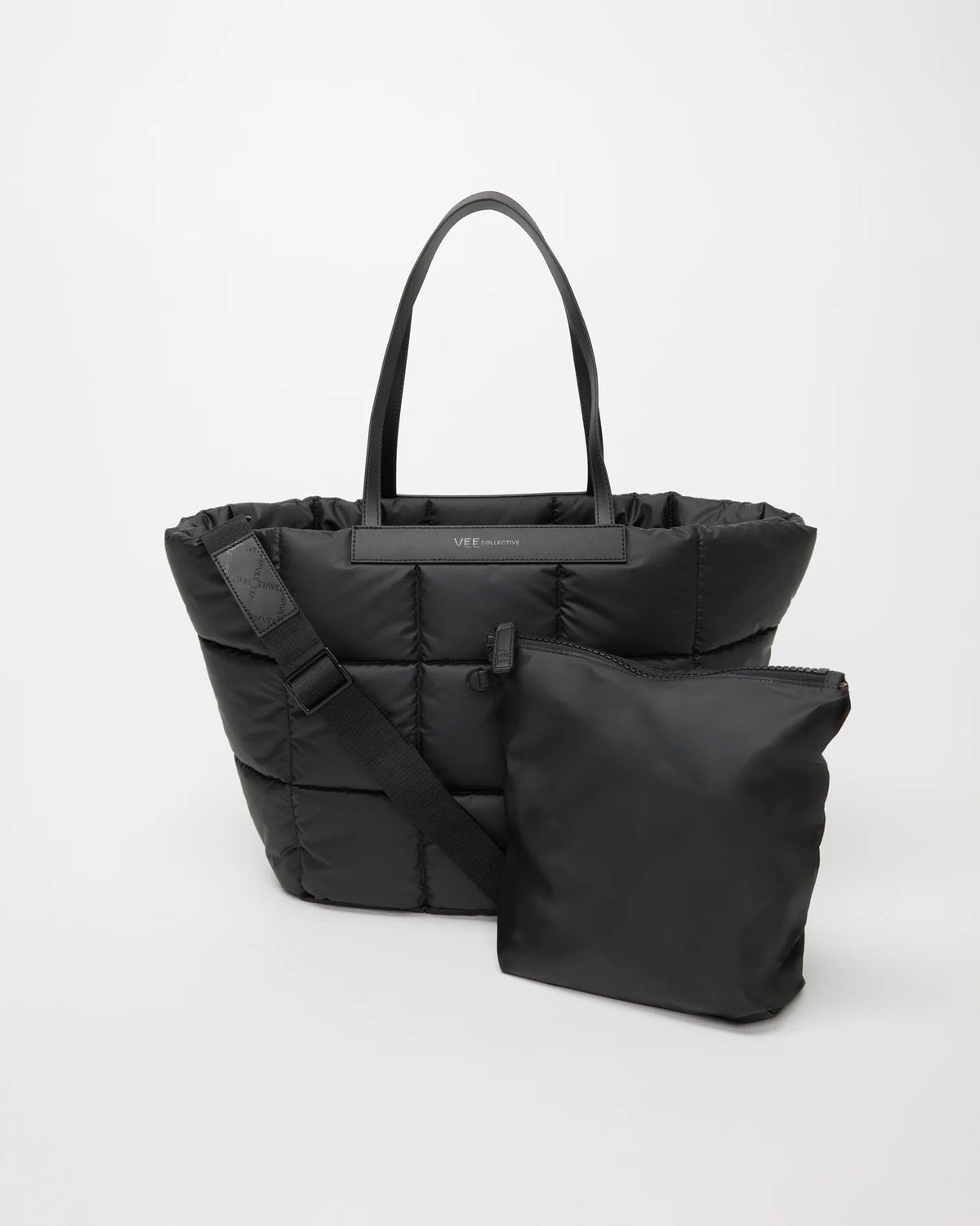 Front view of the Porter Basque Bag in Matt Black by Vee Collective, shown with its matching pouch and detachable strap.