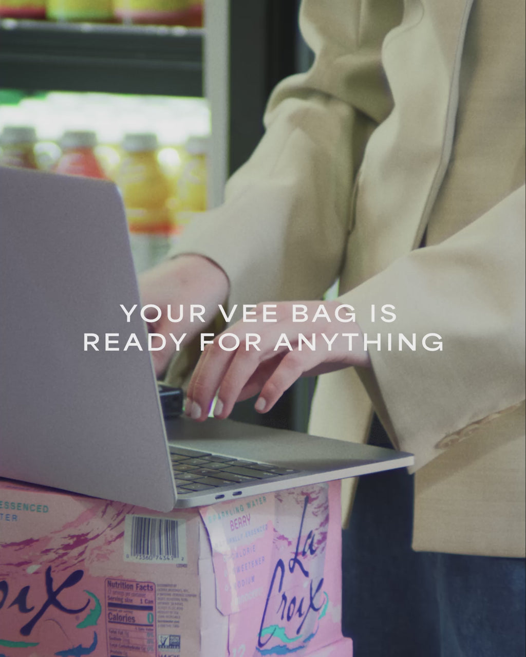 A video featuring a model in a supermarket, carrying an Essence City Tote Black while answering a phone.