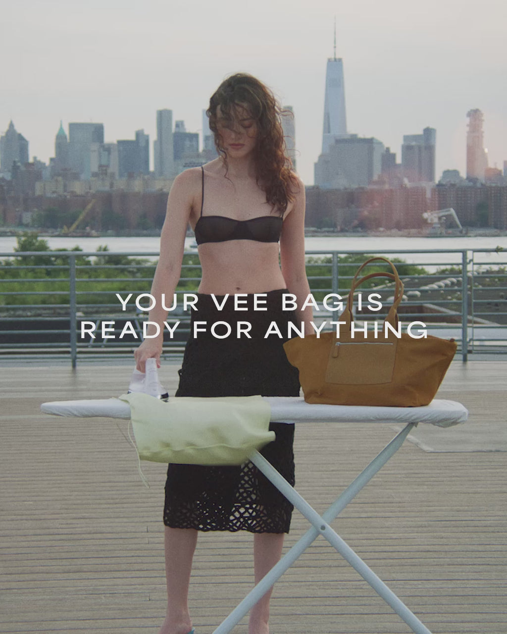 A video featuring a model ironing outdoors, with the Duo Tote Bag placed on the ironing table.