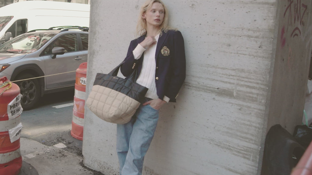 Woman holding Black Desert & Silver Grey Porter Tote Medium on the street of New York.