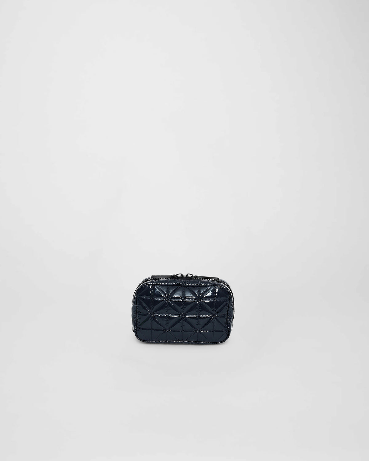A front-view photo of a Vee Belt bag featuring a geometric stitched pattern, set against a plain white background.