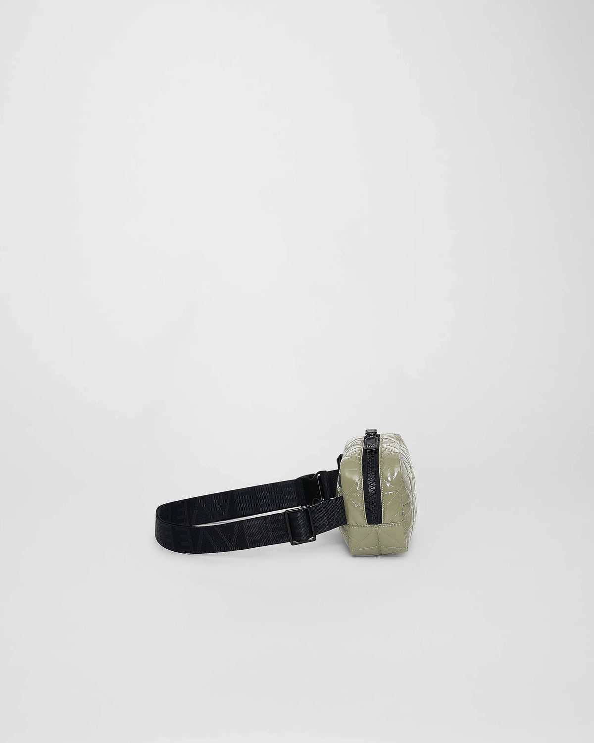 A front-view photo of a Vee Belt bag featuring a geometric stitched pattern and waist straps, set against a plain white background.