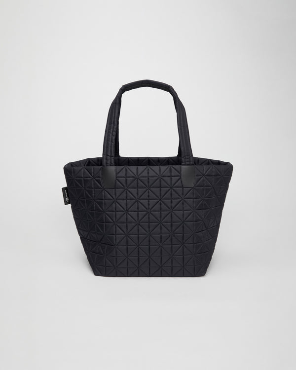 Large black tote bag crafted from lightweight, sustainable, and waterproof materials. Designed for versatility, it’s perfect for  gym sessions, busy moms, work, and travel. Combines stylish design with practical durability for everyday convenience.