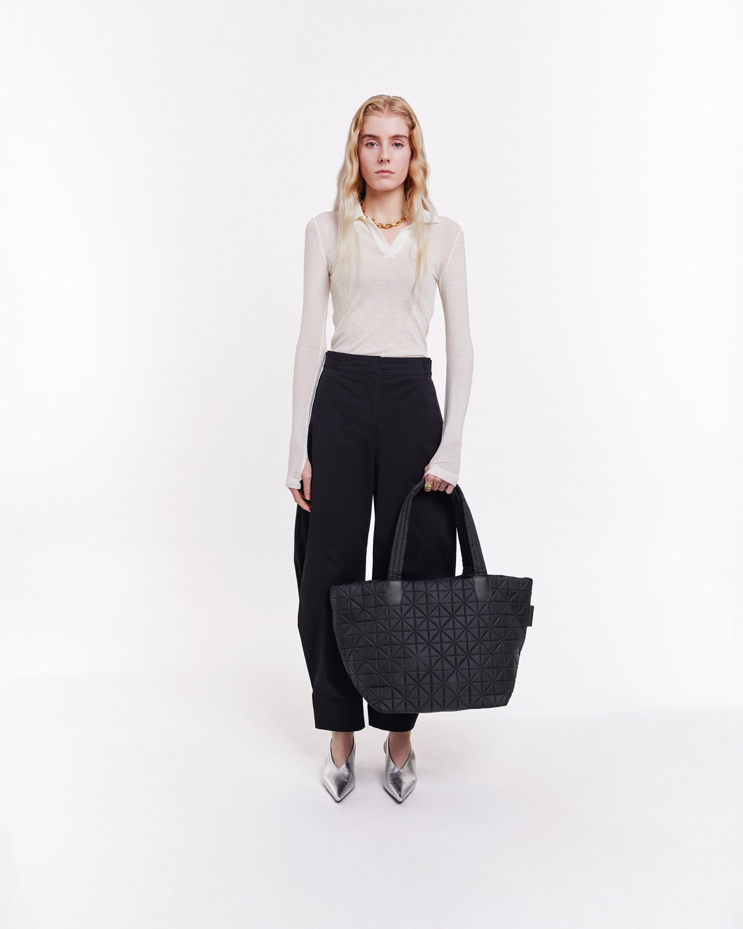 Large black tote bag crafted from lightweight, sustainable, and waterproof materials. Designed for versatility, it’s perfect for  gym sessions, busy moms, work, and travel. Combines stylish design with practical durability for everyday convenience.