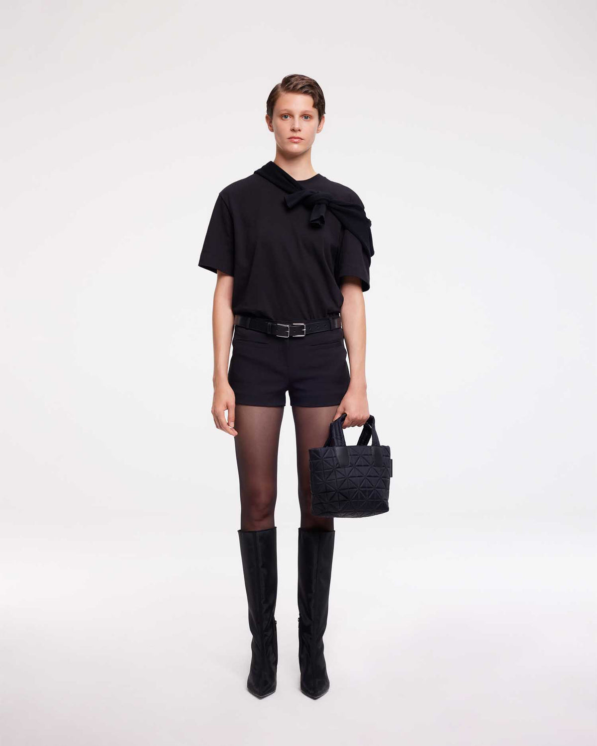 Mini tote bag designed to be versatile and lightweight, made from waterproof materials. Ideal for nights out, concerts, and carrying essentials in style.
