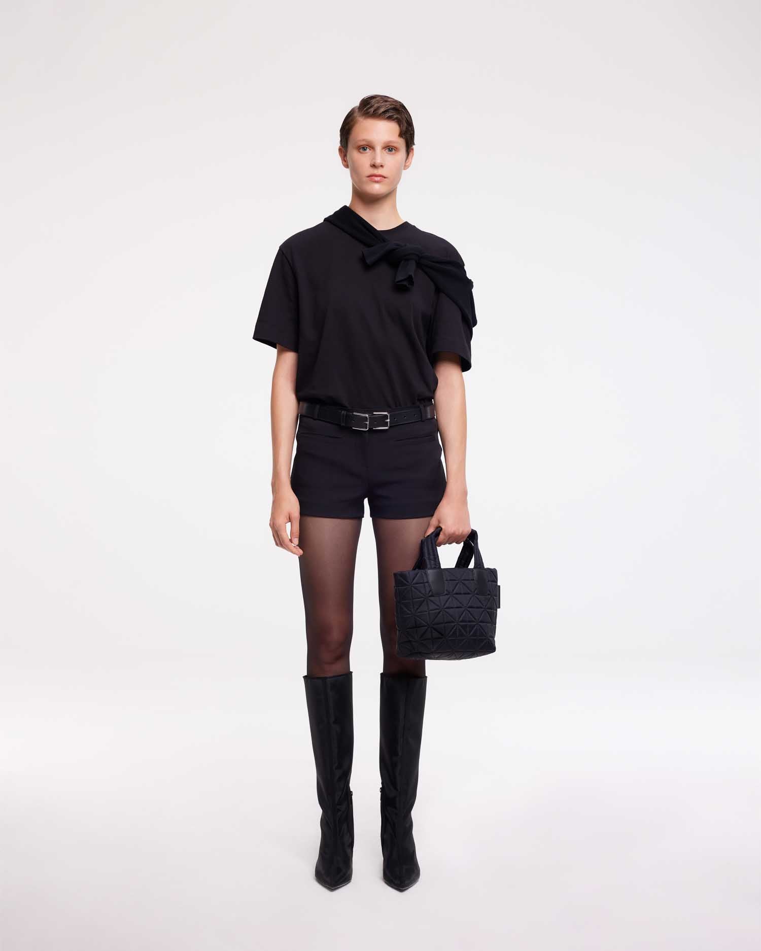 Mini tote bag designed to be versatile and lightweight, made from waterproof materials. Ideal for nights out, concerts, and carrying essentials in style.
