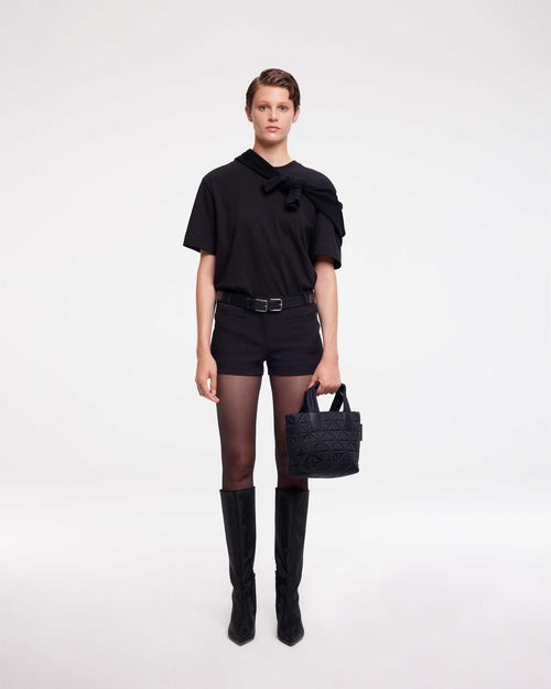 Mini tote bag designed to be versatile and lightweight, made from waterproof materials. Ideal for nights out, concerts, and carrying essentials in style.
