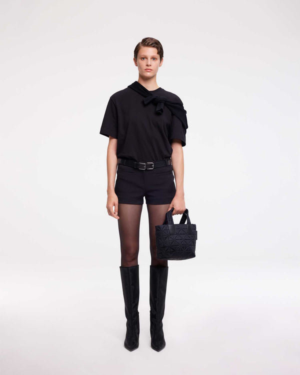 Mini tote bag designed to be versatile and lightweight, made from waterproof materials. Ideal for nights out, concerts, and carrying essentials in style.

