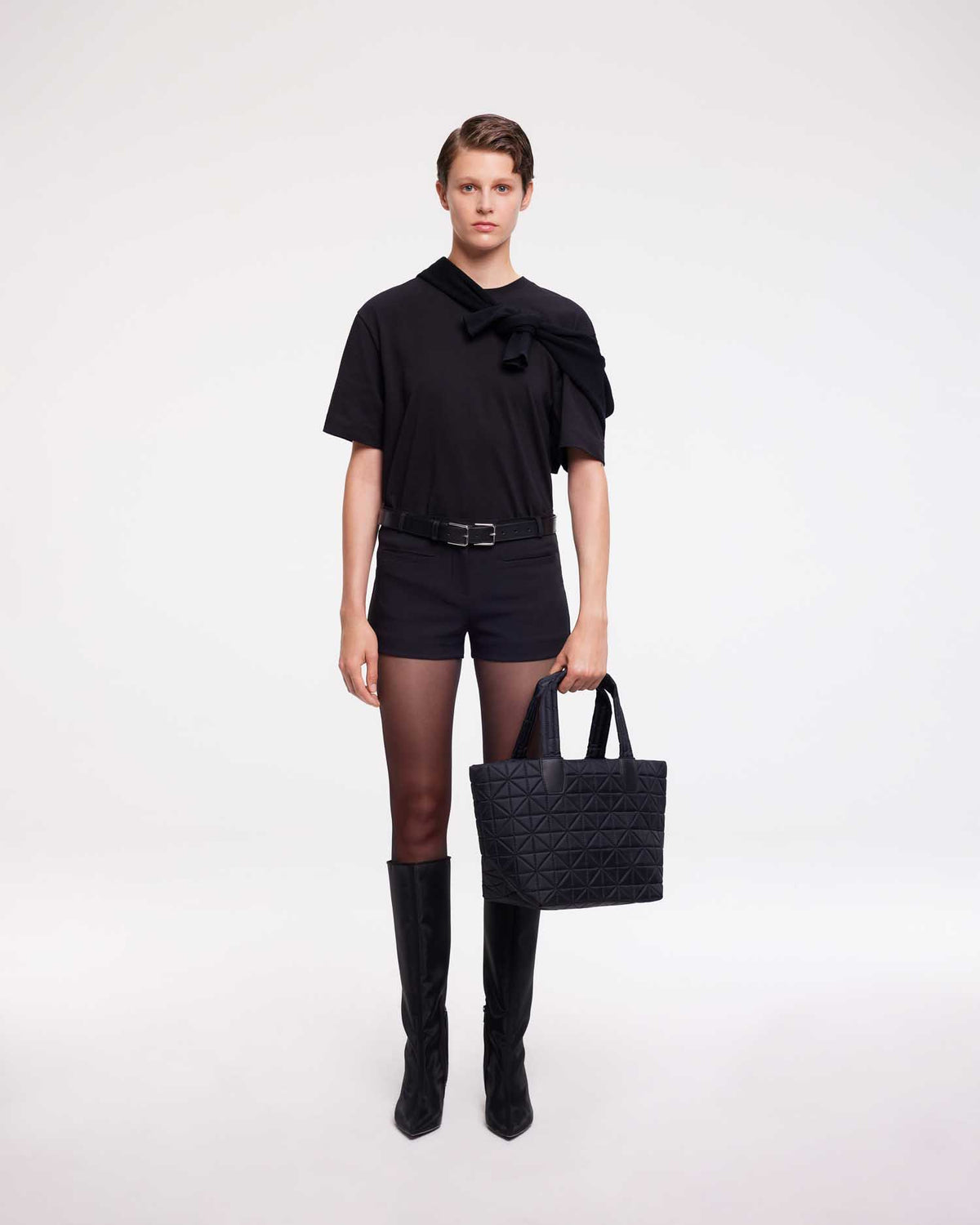 Small tote bag made from waterproof and sustainable materials, designed for versatility and durability. Ideal for work and everyday use, combining practical functionality with eco-friendly style in a compact design.