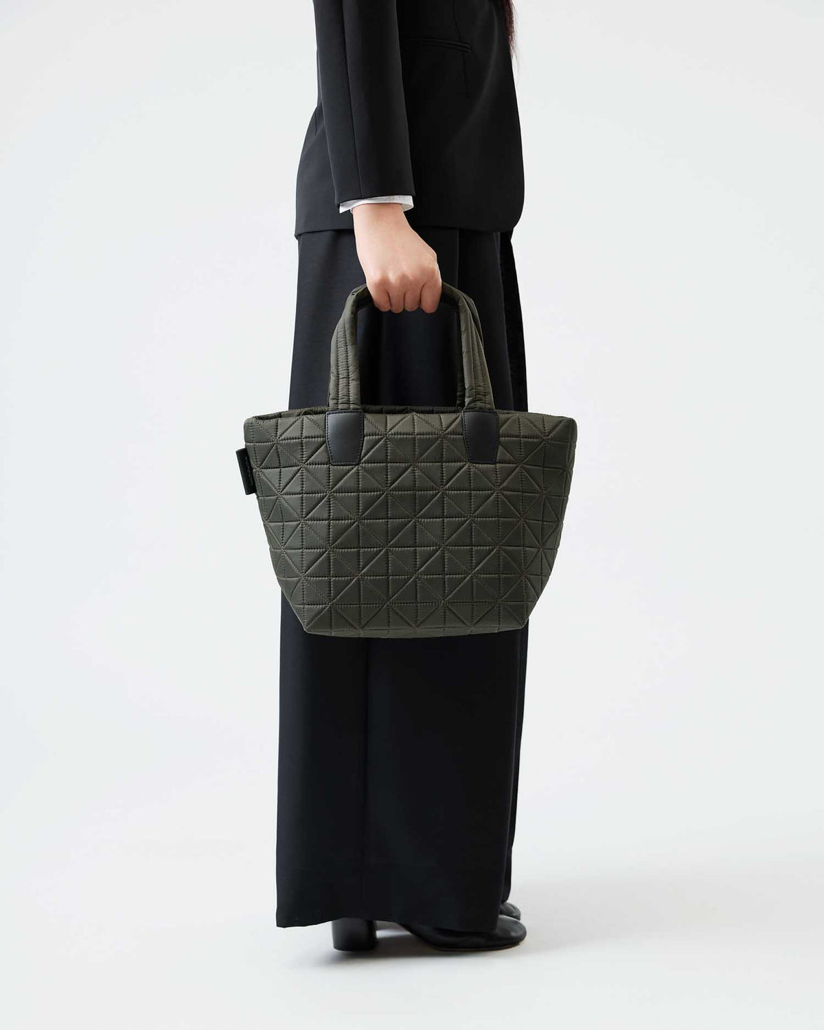 VEE handbag crafted from sustainable, water-resistant materials, combining style and durability. Designed for versatile use, it’s perfect for travel, work, and everyday activities.