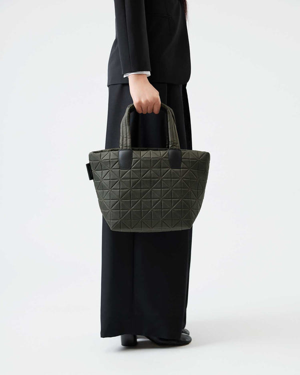 VEE handbag crafted from sustainable, water-resistant materials, combining style and durability. Designed for versatile use, it’s perfect for travel, work, and everyday activities.