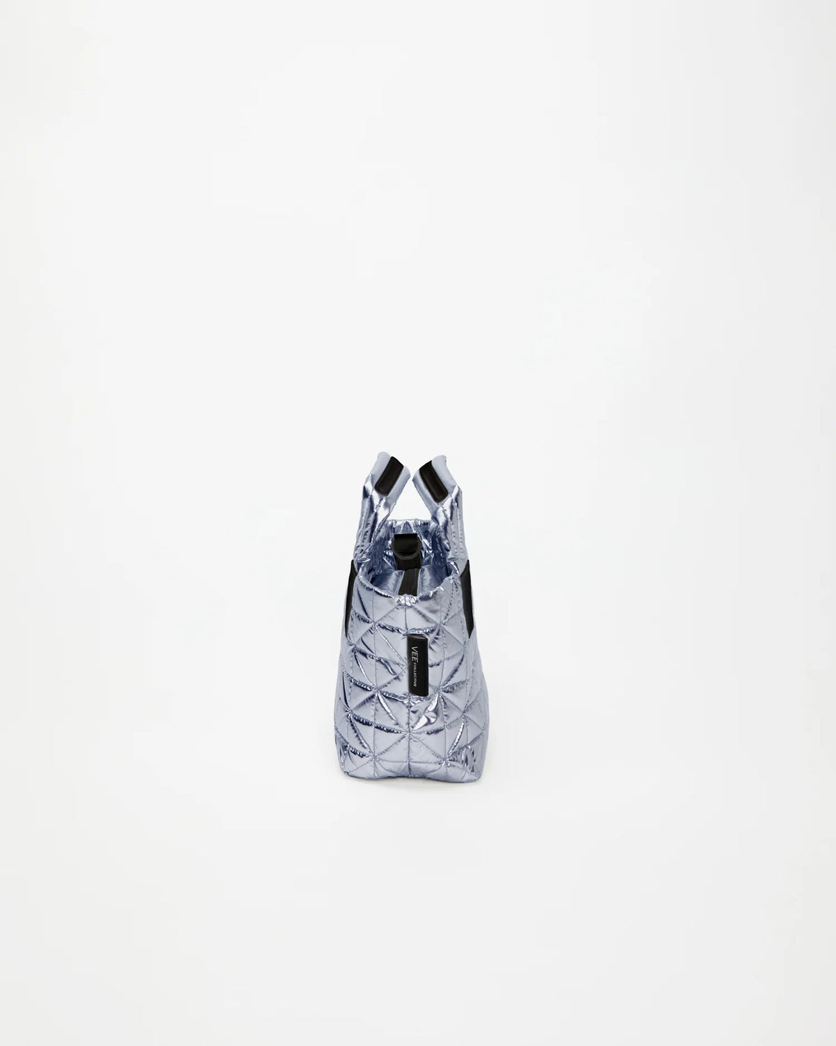 Side view product image of the Vee Mini Tote Bag in Icy Silver by Vee Collective.