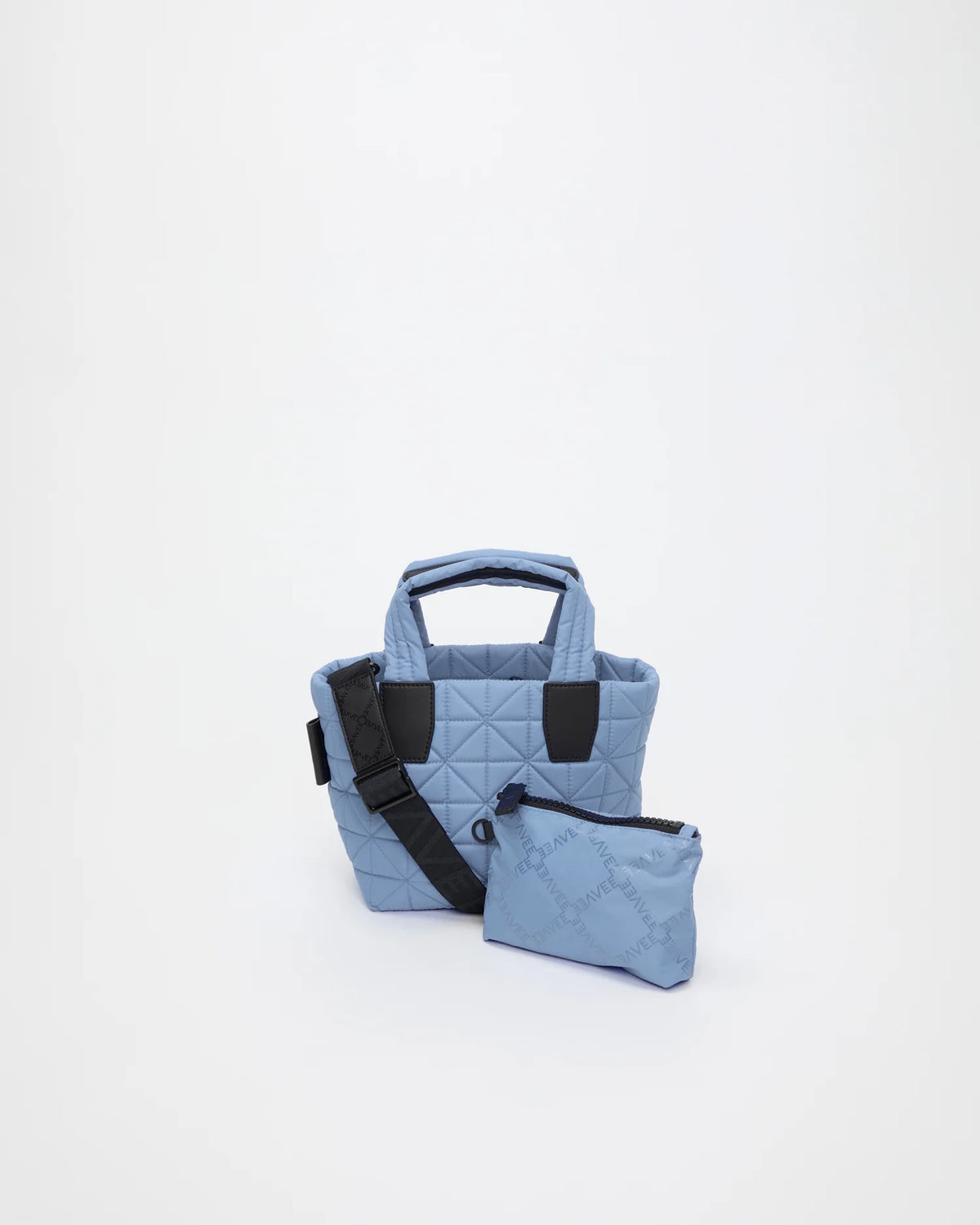 Front view of the Vee Tote Bag Mini in Pigeon Blue, shown with its matching pouch and detachable strap.