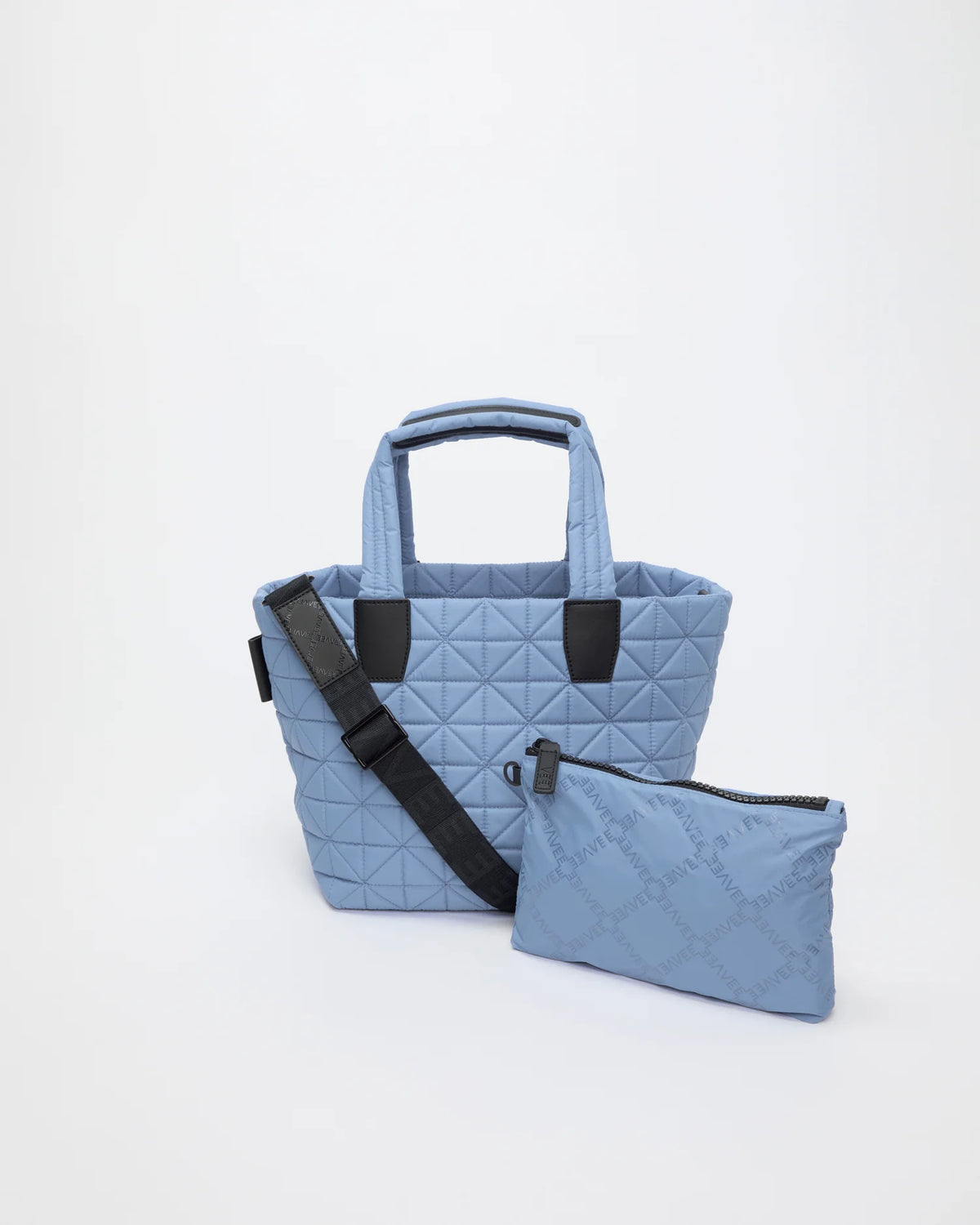 Front view of the Vee Tote Bag Small in Pigeon Blue, shown with its matching pouch and detachable strap.